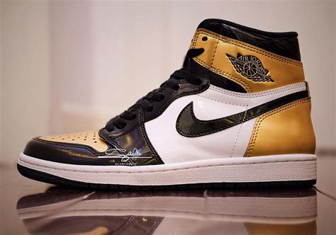 gold and black jordan 1